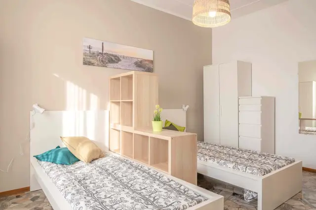 VIA MELI 18 <br> SHARED ROOM D1 - Bed A 1